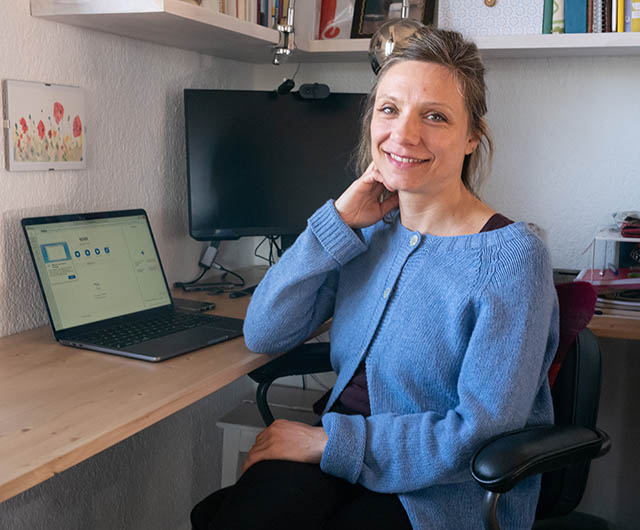Lucia Bernhard at her desk
